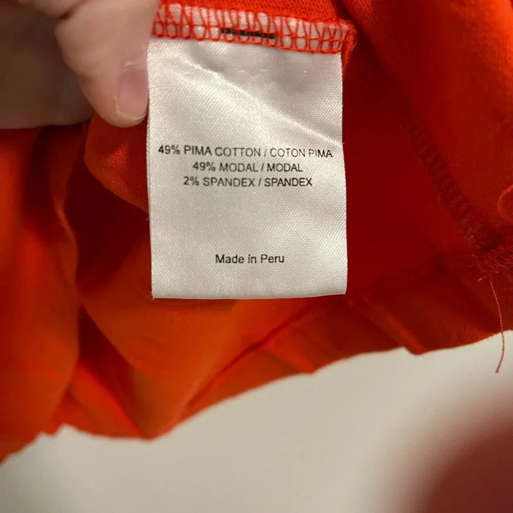 Tory Burch Orange Ruffle Polo Top